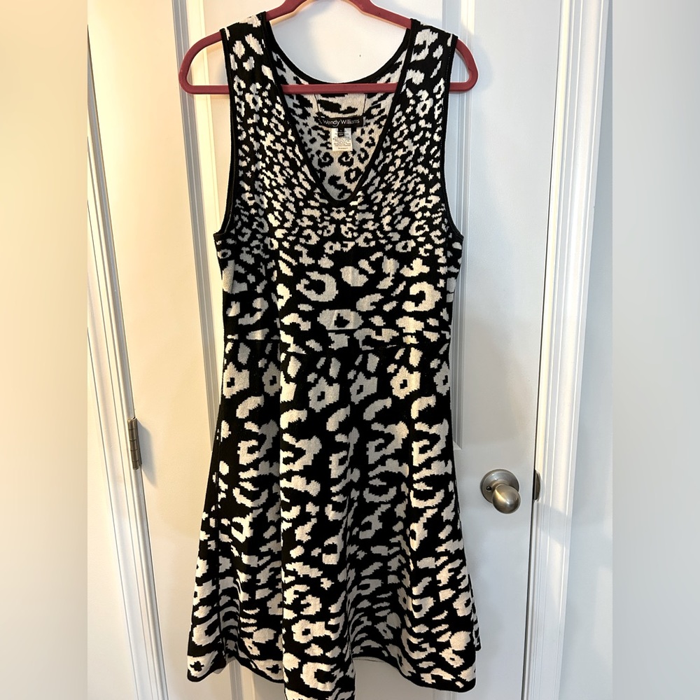 Figure flattering swing sweater dress.